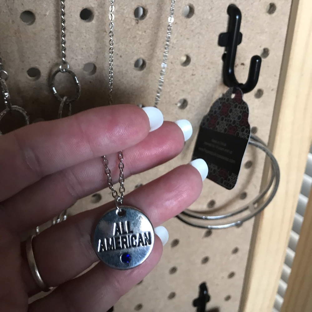 Short silver necklace w/“All American” &blue stone